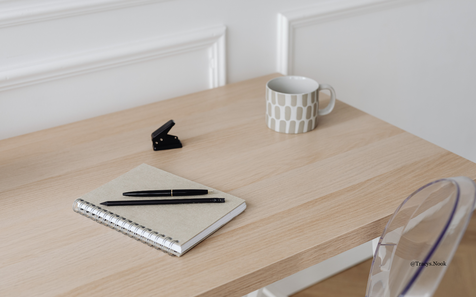 Calm home workspace with a notebook and coffee in natural light, representing reflection on everyday digital habits and online safety.